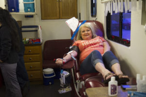 Jeanne Doss from HR gives blood